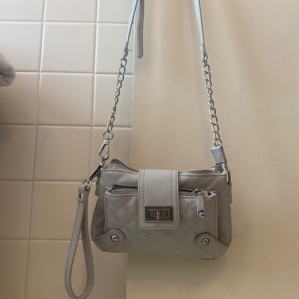 This Charming Charlie’s purse/clutch has three pockets.
